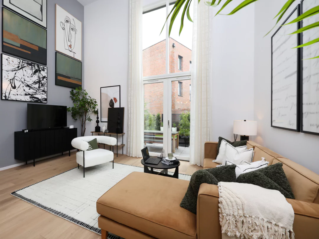 The Prier living room featuring double height ceilings!