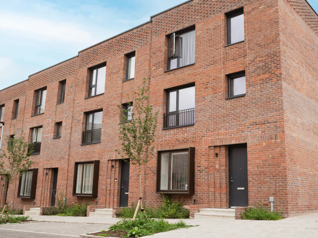 The front exterior of The Brandon red-brick townhouses at Brabazon.