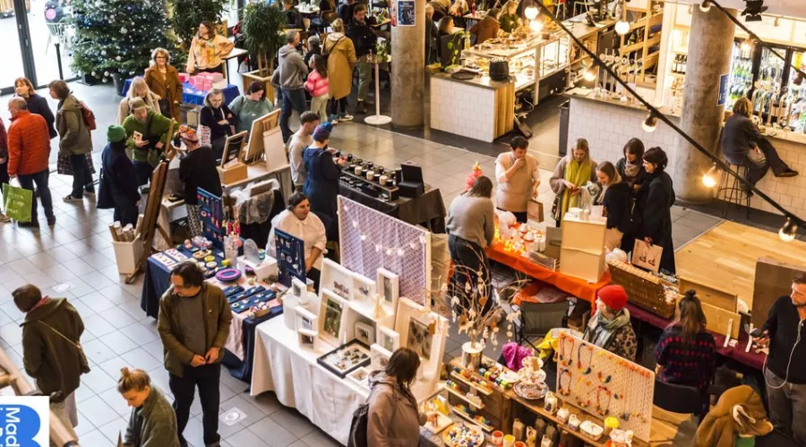 Hands gift wrapping Christmas presents.